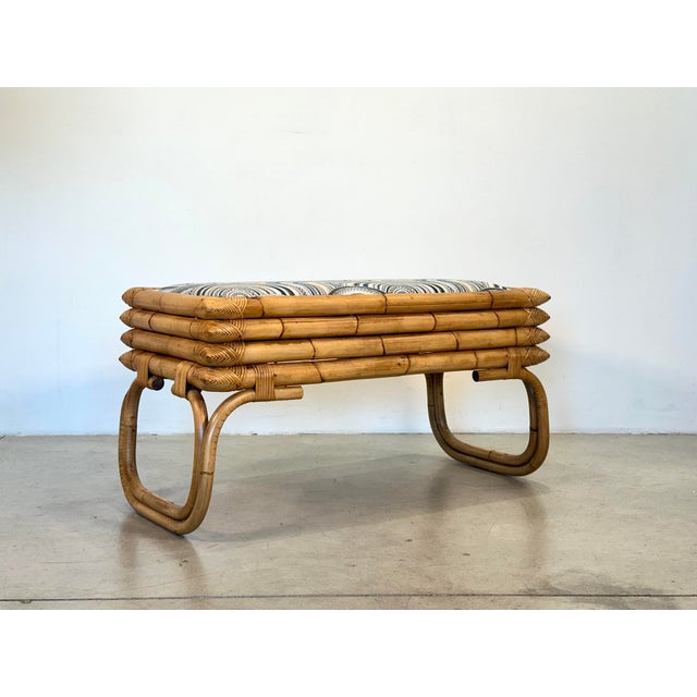 70s rocking bench, bamboo structure, removable seat reupholstered with a new fabric, the lines recall some productions of...