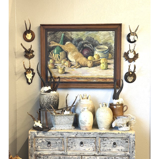 This classic French still life is a common theme in France depicting a hare and harvest items. The impressionist...