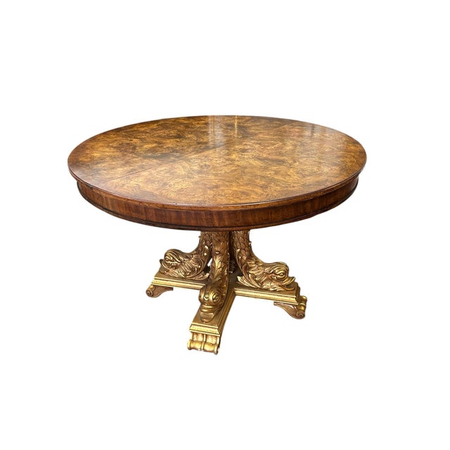 This Regency-style pedestal center table is an elegant nod to classical design. The top is crafted from burled fruitwood,...