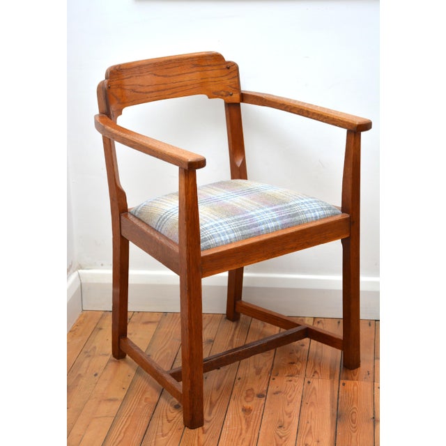 K0656 Stylish English Arts and Crafts Movement solid oak desk chair, having shaped and carved top rails, generous drop in...