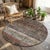 This curated round patchwork rug is a sophisticated exercise in sustainable luxury, expertly assembled from hand-knotted...