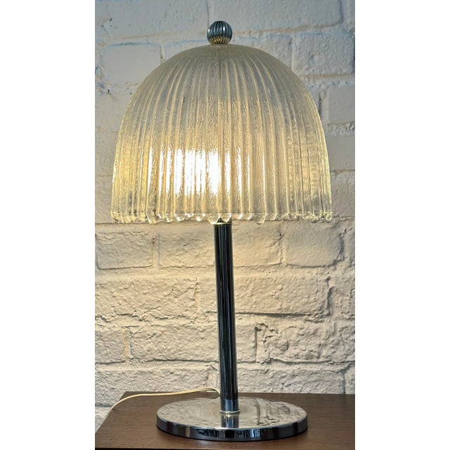 French Art Deco Glass & Chrome Table Lamp. It includes an art deco glass shade attributed to Etling or Sabina and a modern...