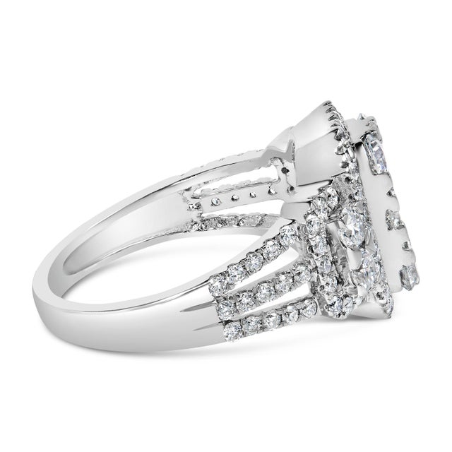 Feel like a beauty queen by wearing this glimmering and highly wonderful diamond ring. Fashioned in 14k white gold, this...