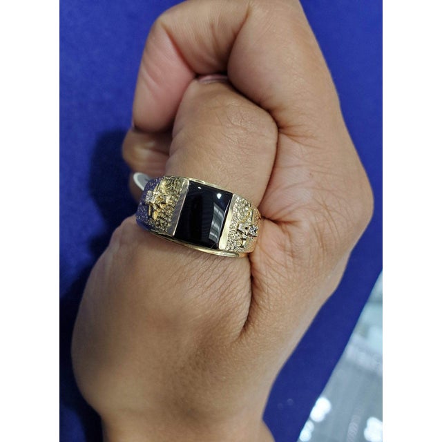 ♥ Product Summary ♥ Main Stone: Onyx Diamond Carat Weight: .04cttw Band Material: 14k Yellow Gold Weight: 8 grams Width: 10mm