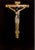 Image of crucifixion in white, rose and yellow gold on black glass, in a black lacquered frame by Julian Brooker.