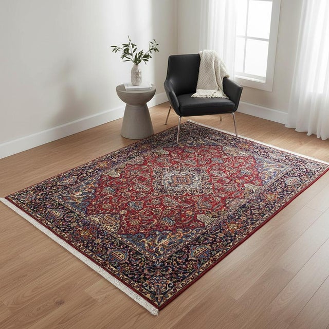 This stunning Vintage Persian Isfahan rug features an intricate floral medallion design set against a rich red field with...