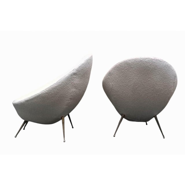 Pair of fabric armchairs designed by Gigi Radice for Lenzi in Italy in the 1950s. The armchairs feature a tapered brass...