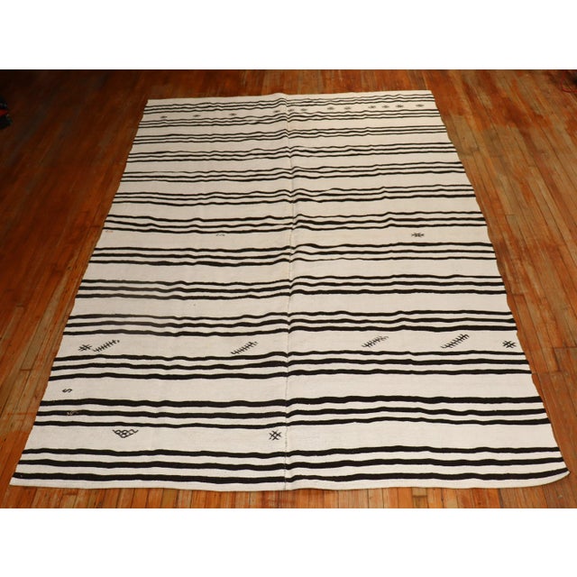 one of a kind mid 20th Century hand-knotted room size Turkish Kilim Kilims, primarily refer to a type of flat woven rug...