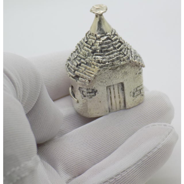 A solid sterling silver trullo figurine, handcrafted in Italy during the 1980s/1990s. This charming architectural...