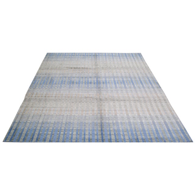 Hand-knotted with care using traditional rug making techniques, this wool rug blends timeless craftsmanship with a modern...