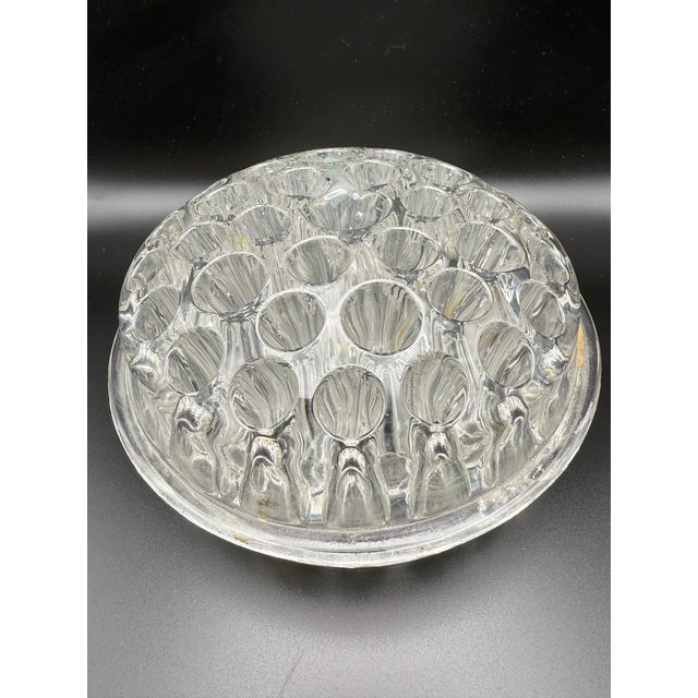 Very rare 37 hole glass flower frog. Measures 6.25 inches in diameter and 3 inches in height. It is marked patent April...