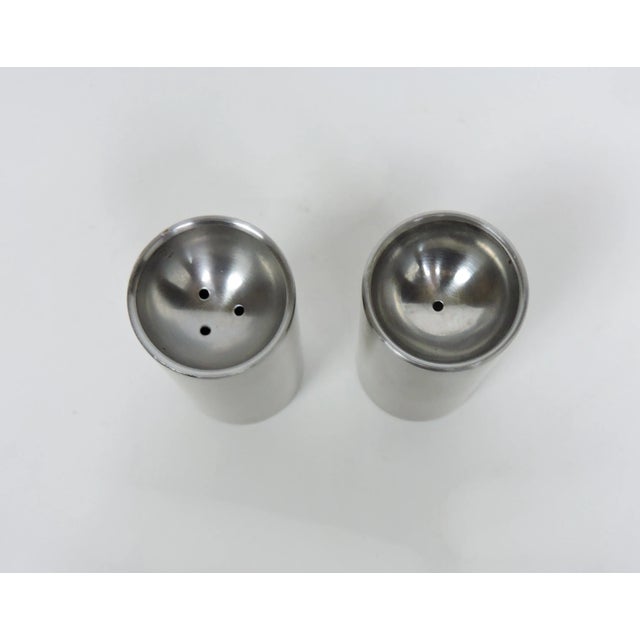 Handsome Cylinda Line salt and pepper shakers designed in 1967 by Arne Jacobsen and made in Denmark by Stelton. Crafted of...