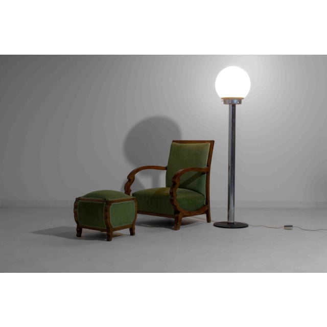 Striking floor lamp from Italy, made in the 1970s. The lamp features a tall chrome-plated stem and a large opaline glass...