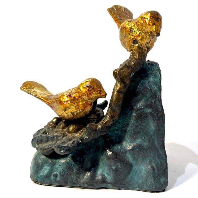 Charming pair of cast metal bookends. Gilt birds sit atop a grey base with verdigris wash. Felt covered bottom. Unmarked....
