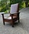 Highly sought after Stickley Chair. OAK, Upholstery Antique. Offers a slat form back and carmine tone fitted durrable...