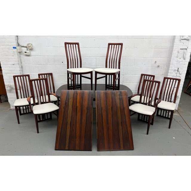 Presenting an exceptional and highly sought-after vintage Danish Mid-Century Modern dining set, a true testament to the...