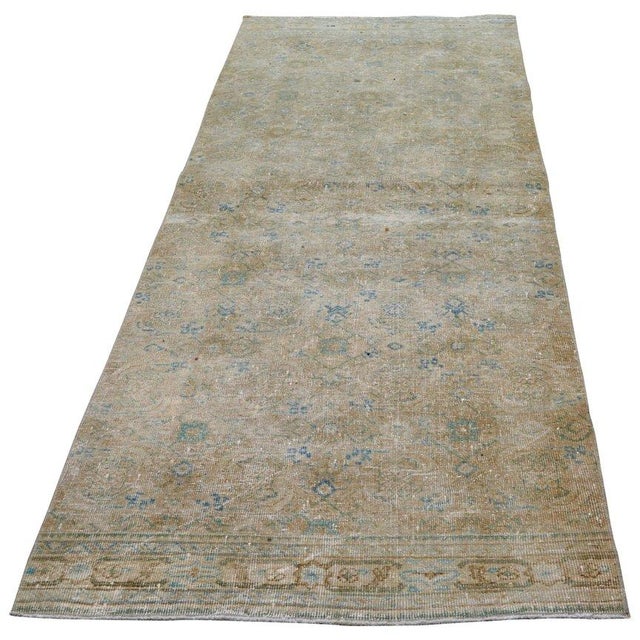 Hand-knotted with care using traditional rug-making techniques, this wool rug blends timeless craftsmanship with a modern...