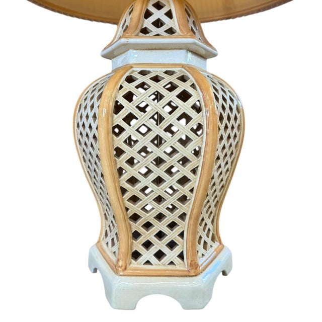 A 1970s Italian reticulated ceramic table lamp; Asian ginger jar form in a classic lattice pattern highlighted by shades...