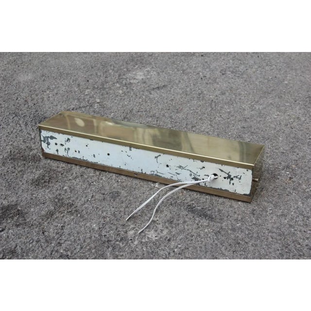 This is an Italian sconce from about 1950s in brass and Acrylic Glass. It has a particular design and is minimalistic,...