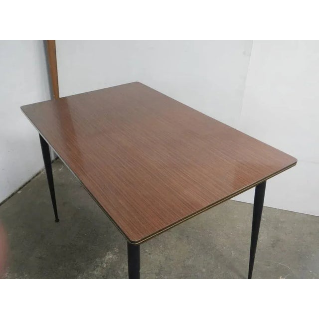 The drawer measures 37x40 H8 with brass handle in black colored metal legs