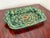 A hand-painted Mexican Talavera earthenware dish. It is deep and rectangular with tab handles on each end. The glaze is a...