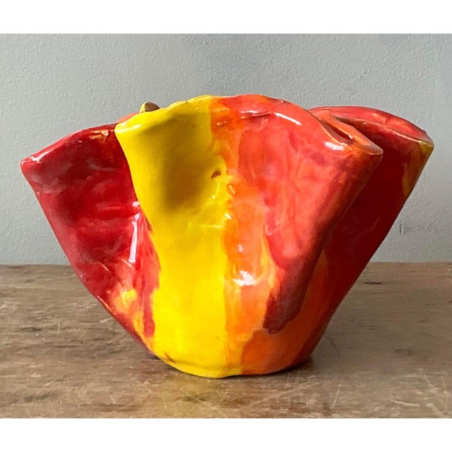 This dramatic art glass bowl is a superb example of expressive 20th-century design, featuring an organic, asymmetric form...