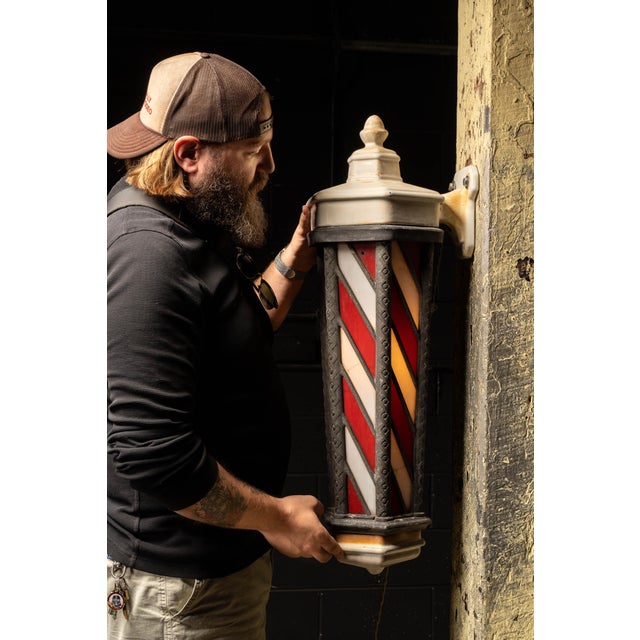 A striking illuminated barber pole manufactured by Koken Barbers’ Supply Co. of St. Louis, Missouri, circa 1920s. One of...