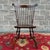 A vintage Nichols & Stone American Traditional solid cherry comb back Windsor dining chair or desk chair in dark brown...