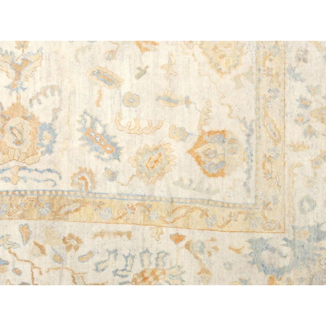 This Antique Turkish Oushak Rug, woven by hand using wool on a wool foundation in the Oushak region of Western Turkey,...