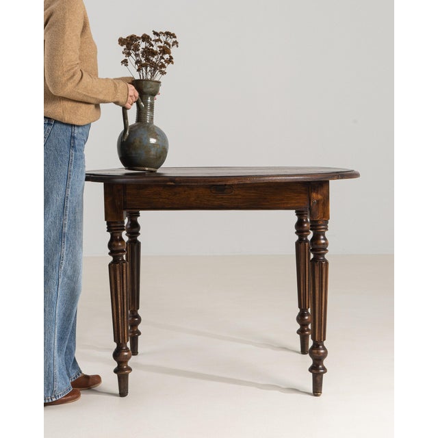 This piece presents as a side table, distinguished by dark walnut, turned legs. Originating in France during 19th Century,...