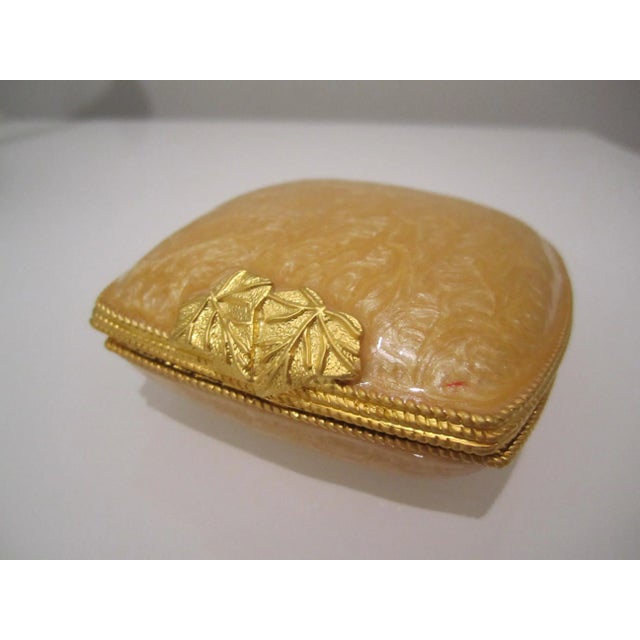 Offered is an elegant oyster style trinket case in gold color