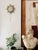 A striking pair of vintage sunburst wall sconces, cast in solid bronze with sculptural rays radiating around a softly...