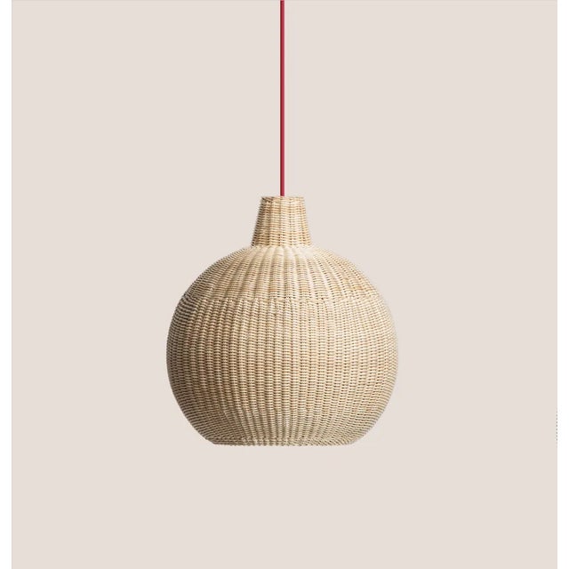 with a large spherical shade made with a maximum of 138 meters of woven wicker, the lamps call for expert handiwork to add...