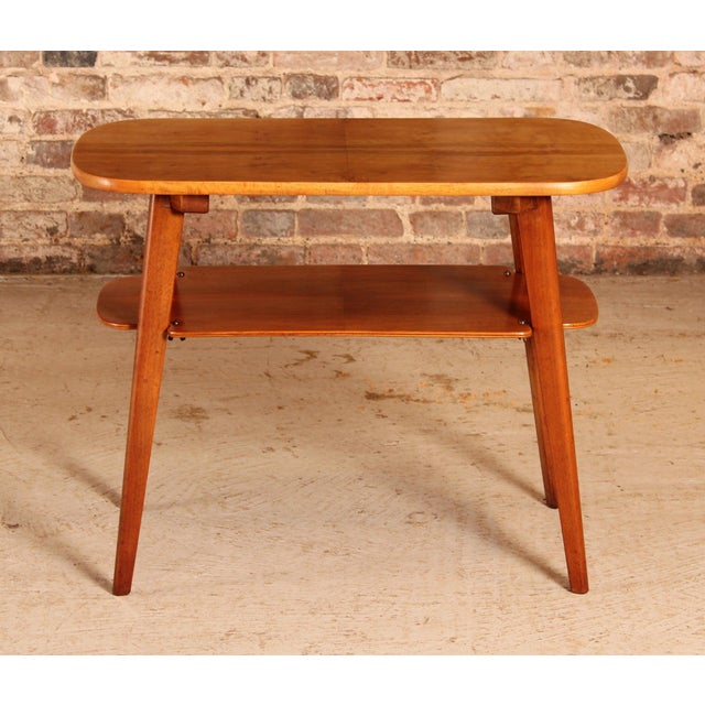Mid Century walnut coffee/side table with a magazine rack, circa 1960s. Excellent condition. W 80cm D 46cm H 62cm