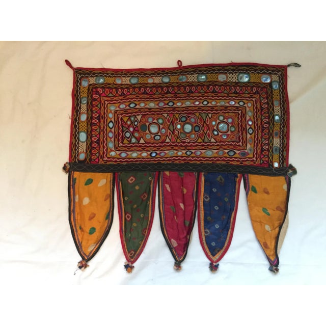 A vintage hand-embroidered mirrored cotton door or window valance with ribbon tassels. One of a kind. Purchased in Jaipur,...