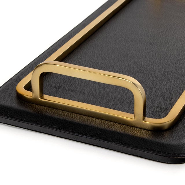 Available with brass or nickel accents, the Greyson Rectangle Trays are crafted from smooth, structured leather for a...