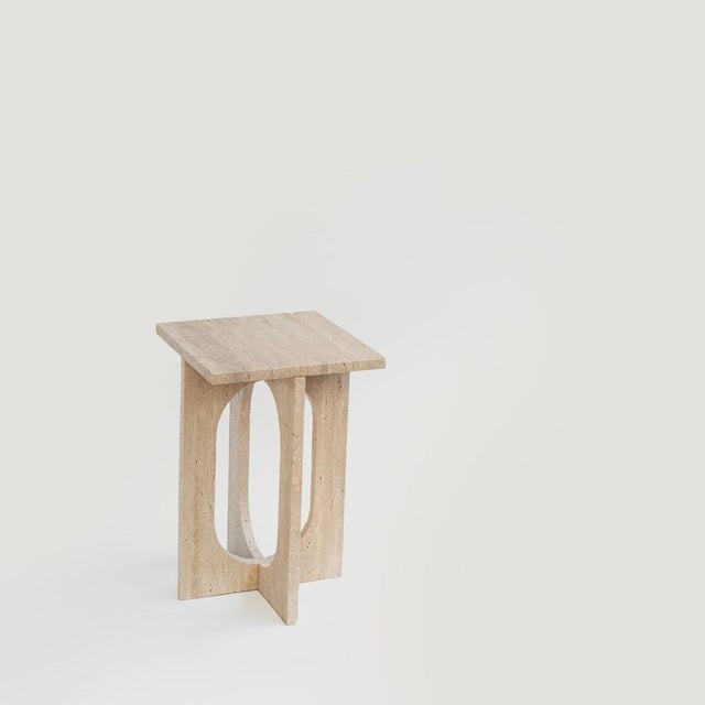 BOND Side Table in Travertine - Bond Side Table evokes simplicity with its modern, clean design. Crafted from honed...