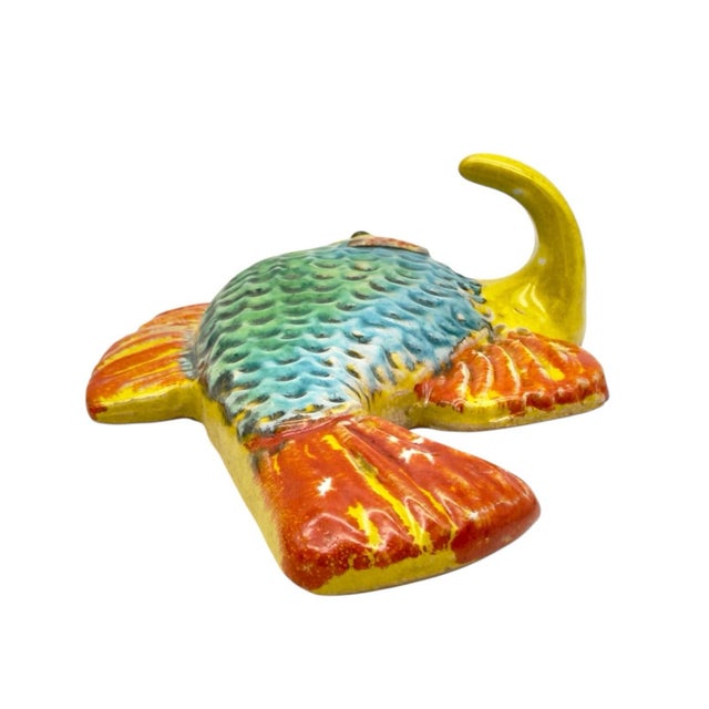 Hand-painted in Italy, this fabulous Italian Fish Ceramic Wall Plaque & Hook is crafted from terracotta or red-ware clay...