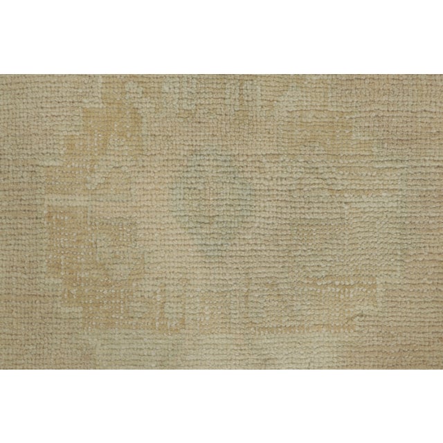 This gift-size vintage 2x3 Turkish rug, circa 1950–1959, features a softly distressed medallion design rendered in ivory,...