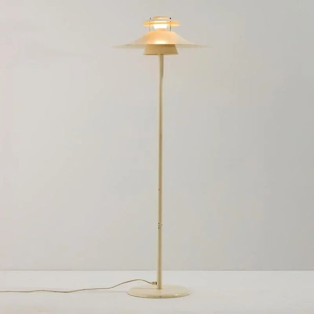 Danish ‘Bolero’ aluminium floor lamp from the 1980s produced by Design Light A/S. The surface of the lamp has scratches,...