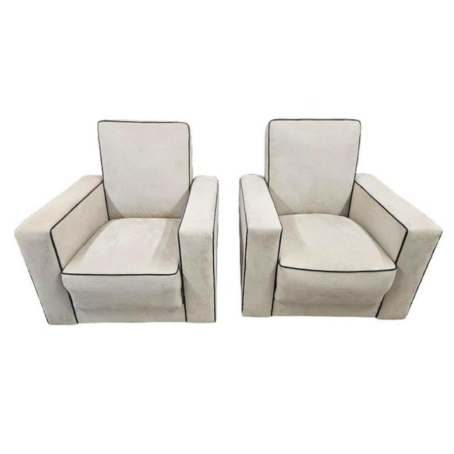 A superb pair of British Art Deco reclining armchairs dating to circa 1930, combining bold geometric proportions with the...