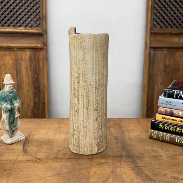 "About This Piece About This Piece Raw and elemental, this vase feels as if it has been shaped directly by nature. Its...