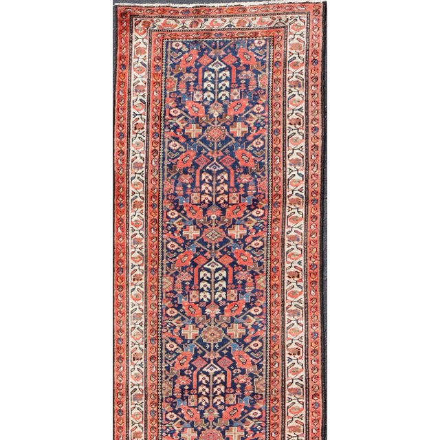 Early 20th Century Antique Malayer long Runner Rug in Blue, Orange and Brown Measures: 3'4 x 16'10 Antique Malayer runner,...