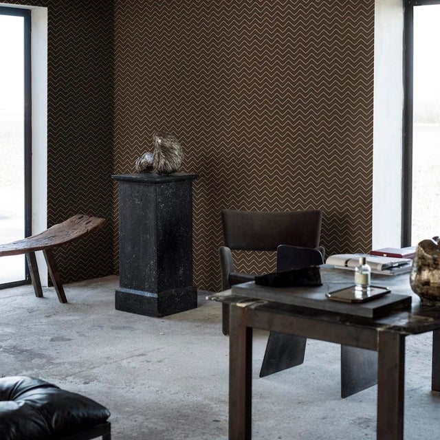 Chevron Dots in brown-and-gold is a wildly chic wallpaper pattern consisting of wavy, zigzagging lines that appear to move...
