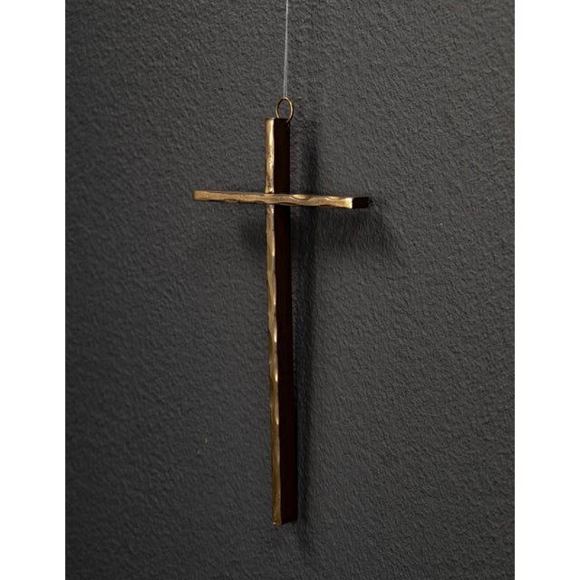 This minimalist cross impresses with its clear geometric forms and timeless proportions. The brass cross is a testament to...