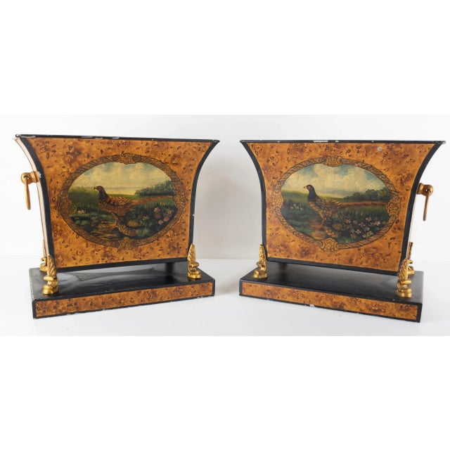 We are selling this decorative pair of tole planters. These simple planters are painted metal with faux wood style...