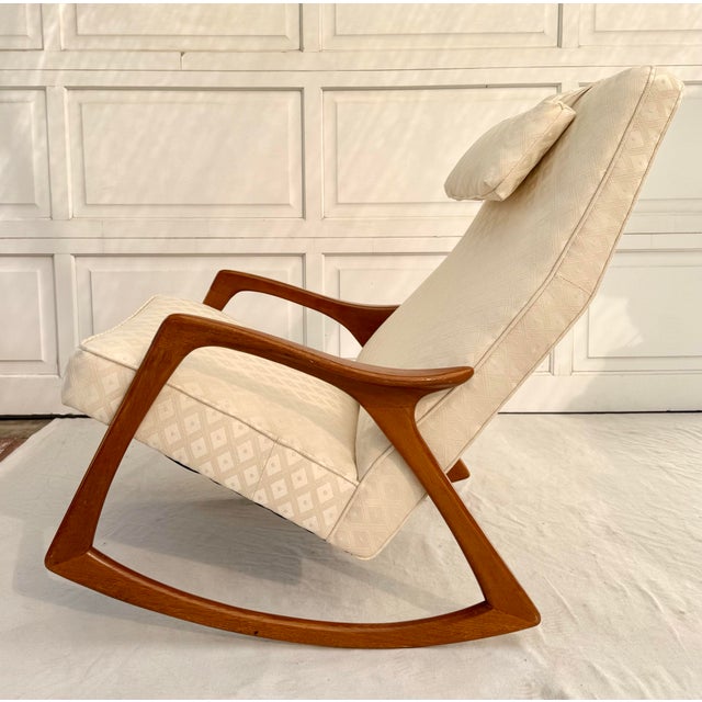 This design-forward Scandinavian modern rocking lounge chair, produced by Bröderna Anderssons around the 1960s, features a...