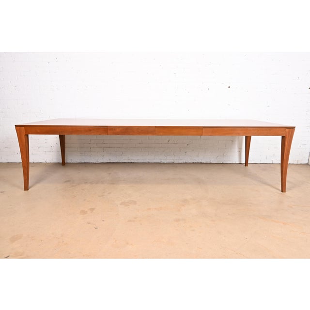 A gorgeous Modern extension dining table By Bill Sofield for Baker Furniture USA, Early 21st Century Book-matched walnut,...