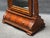 An impressive full-length floor mirror with a grand, architectural presence and richly carved detailing throughout. The...