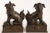 Bronze with dark patina; these Japanese Komainu and Shishi fu dogs sit on rectangular bases with fretwork designs. They...